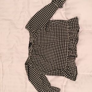 White and black checkered blouse